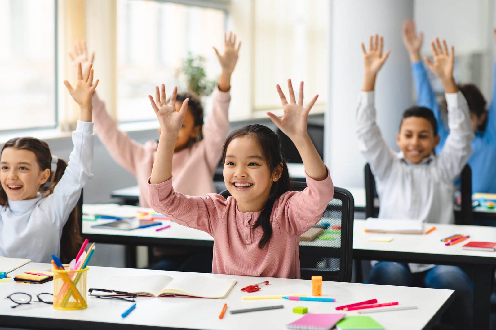 student raising hands